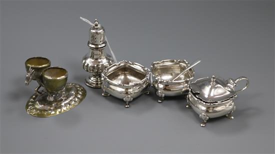 Four silver condiments and a novelty plated donkey double condiment.
